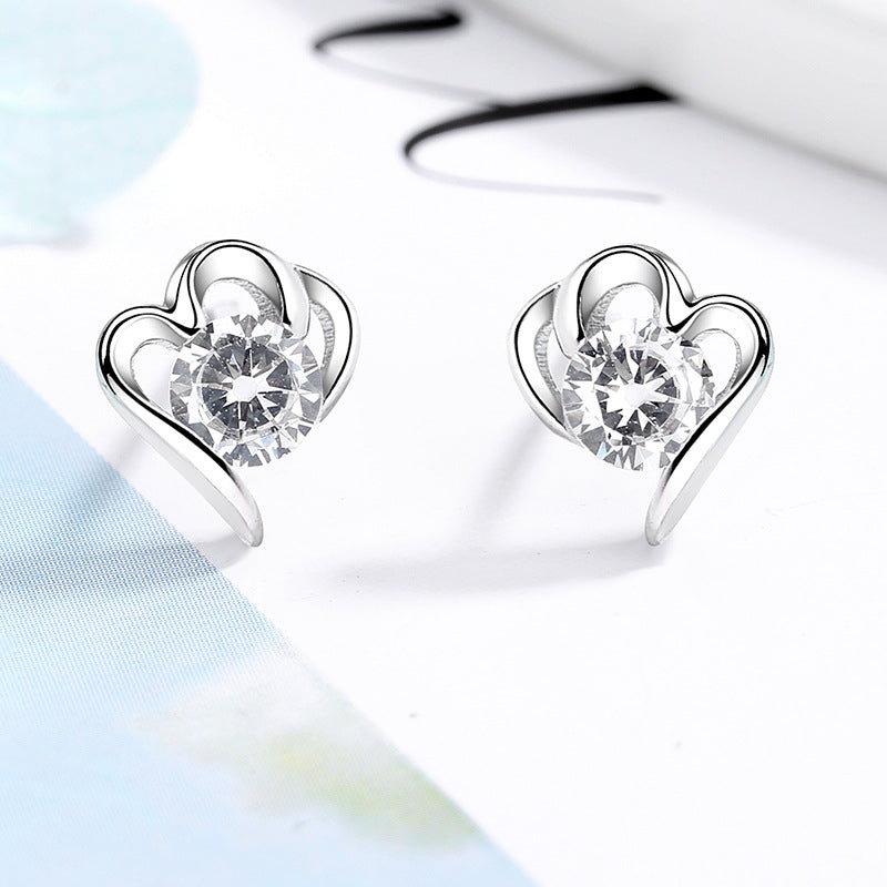 Women’s stud earrings with stylish heart design and sparkling crystals Symbol Fashion