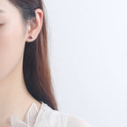 Women's earrings with sparkling heart accents made of high-quality stainless steel Symbol Fashion