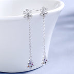 Women’s earrings with sparkling snowflake pendant and chain embellishment Symbol Fashion