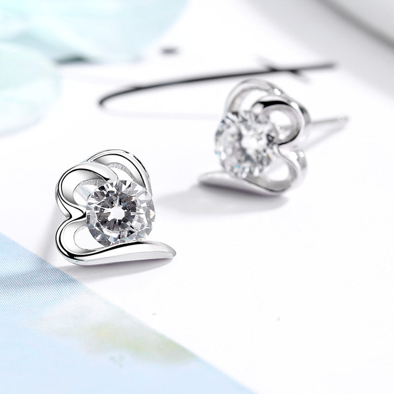 Women’s stud earrings with stylish heart design and sparkling crystals Symbol Fashion