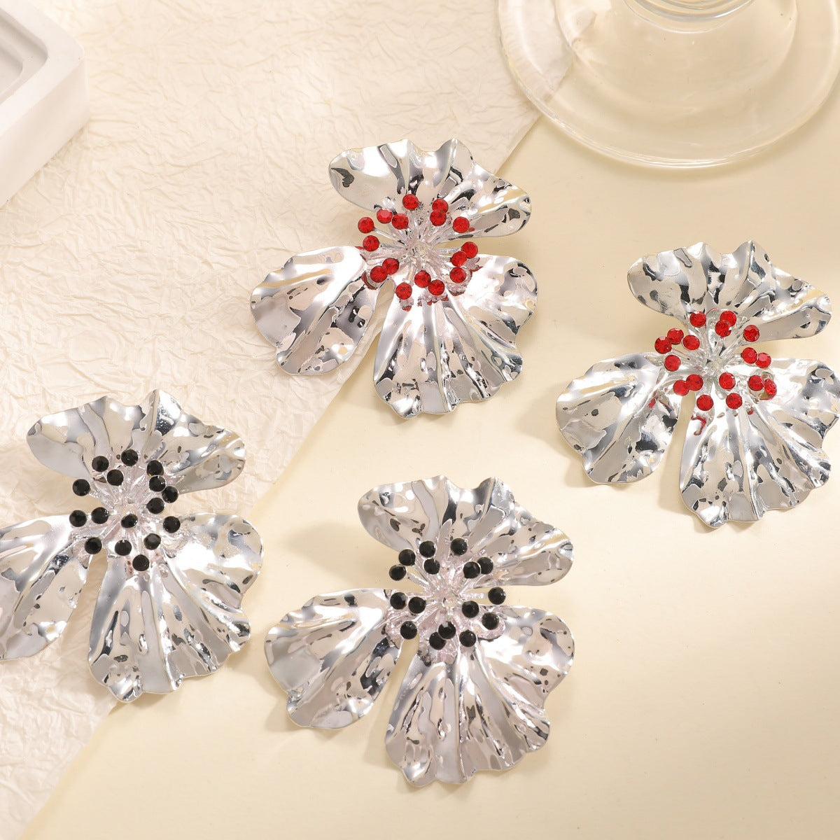 Women’s metal flower earrings with sparkling red accents Symbol Fashion