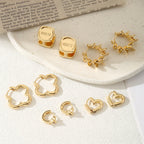 Ladies hoops in unique, sculptural design Symbol Fashion