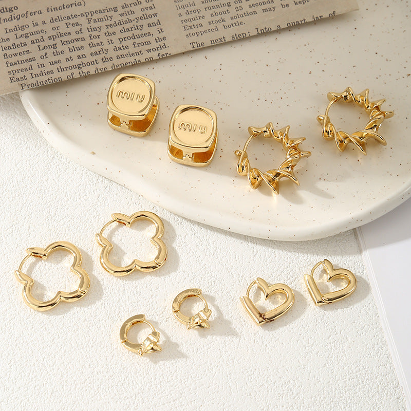Ladies hoops in unique, sculptural design Symbol Fashion