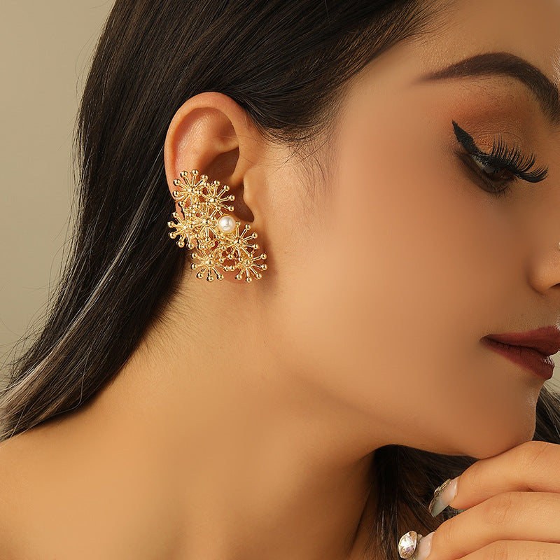 Women’s ear clips with elaborate flower design and pearl accent Symbol Fashion