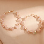Ladies hoop earrings with luxurious pearl accents and elegant, twisted design Symbol Fashion