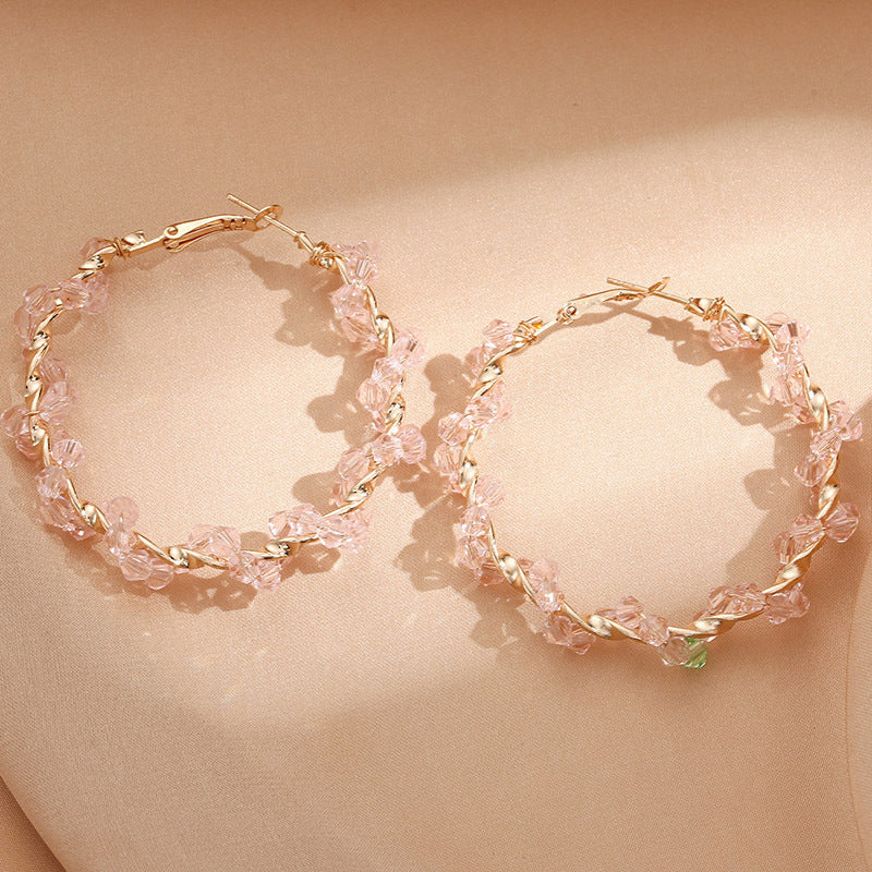 Ladies hoop earrings with luxurious pearl accents and elegant, twisted design Symbol Fashion