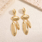 Women Hanging Earrings with artistic, three-dimensional design Symbol Fashion
