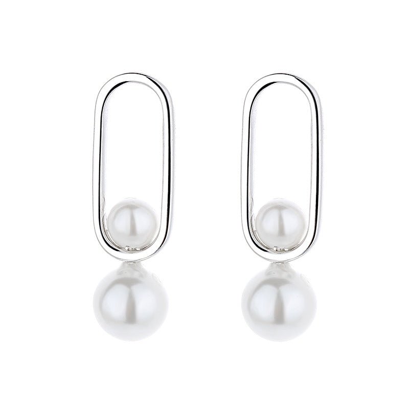 Women's stud earrings with modern oval design and elegant pearls Symbol Fashion