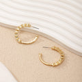 Ladies hoop earrings with intricate structures Symbol Fashion