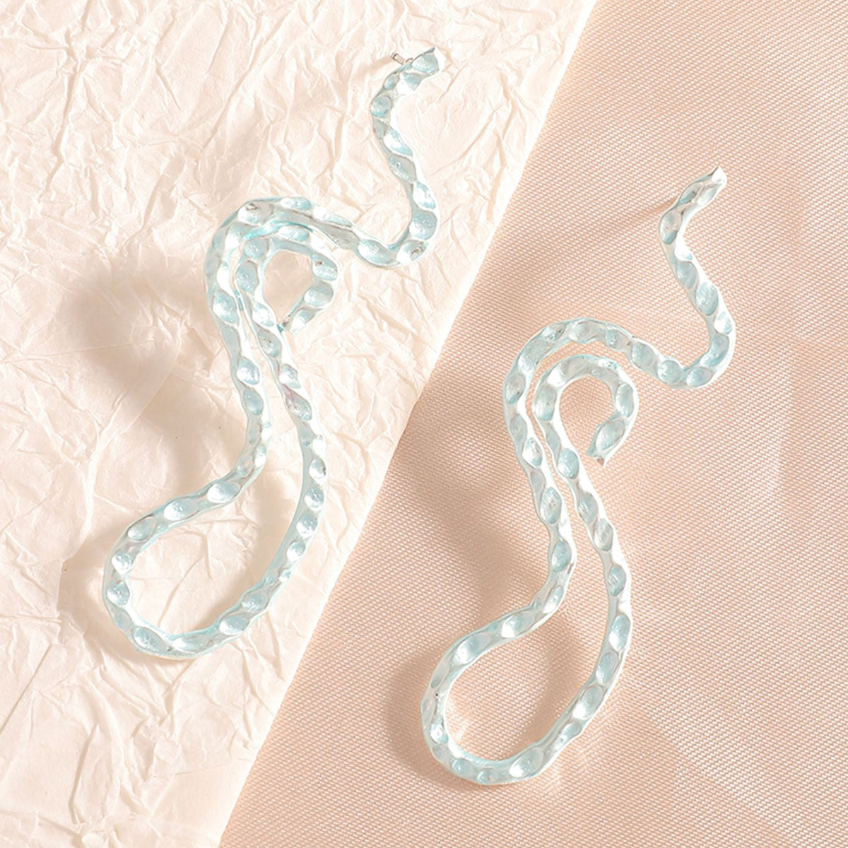 Ladies earrings in elegant wave pattern Symbol Fashion