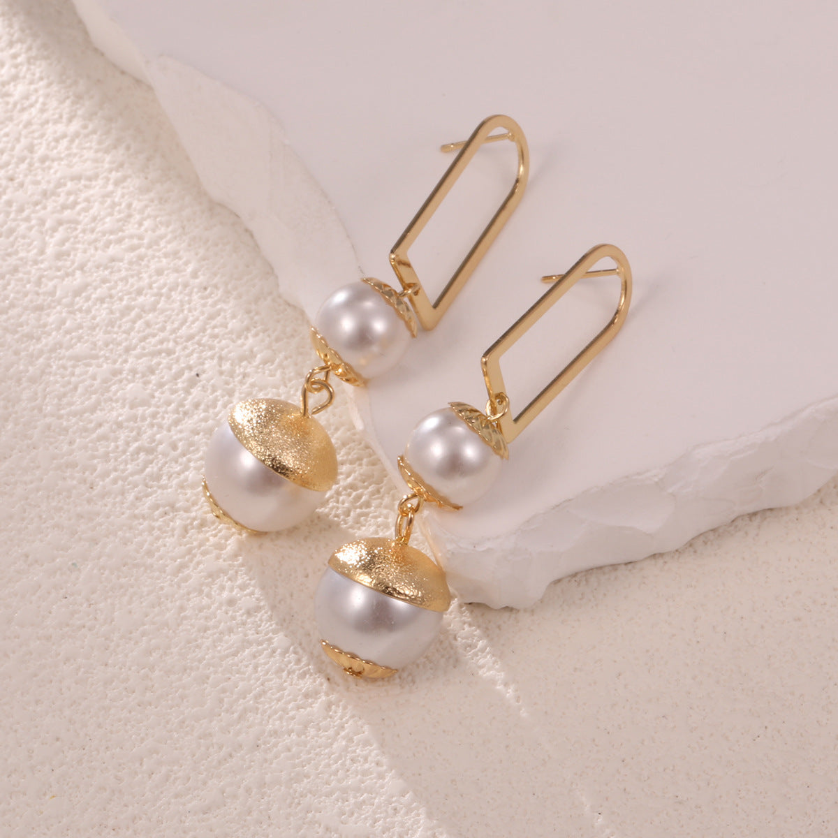 Ladies earrings with elegant pearl design Symbol Fashion
