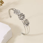 Women's cuff bracelet with artistic leaf motif Symbol Fashion
