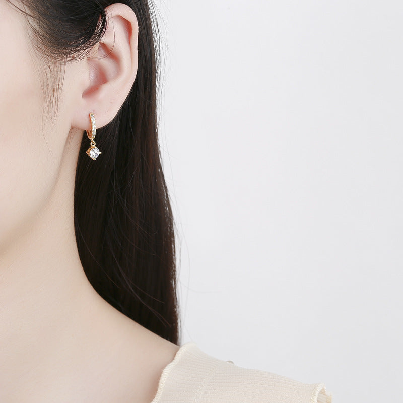 Ladies earrings with sparkling crystals and high-quality gold plating Symbol Fashion