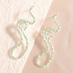 Ladies earrings in elegant wave pattern Symbol Fashion