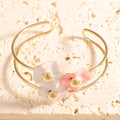 Women's bangle with elaborate floral design Symbol Fashion