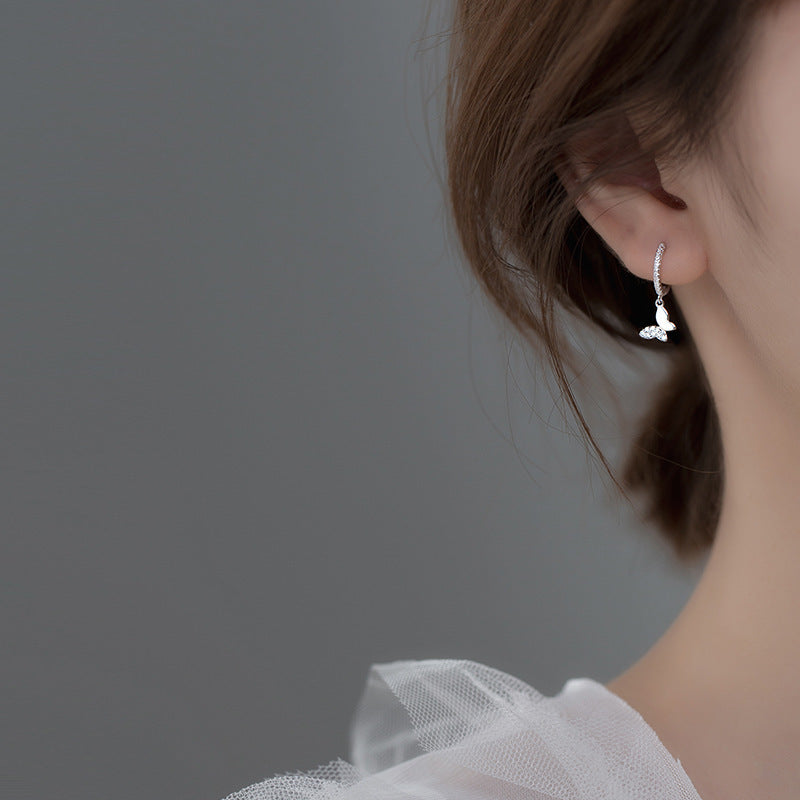 Ladies earrings with elegant butterfly design and sparkling details Symbol Fashion