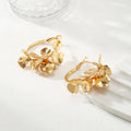 Ladies Creoles with artistic floral ornament Symbol Fashion