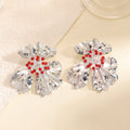 Women’s metal flower earrings with sparkling red accents Symbol Fashion