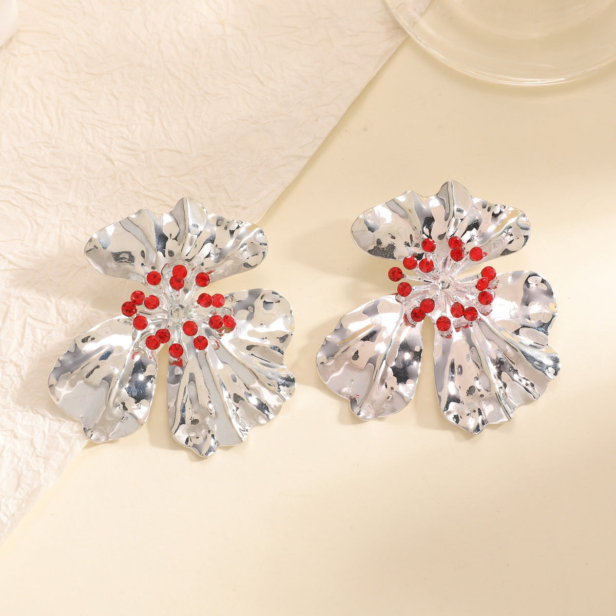 Women’s metal flower earrings with sparkling red accents Symbol Fashion