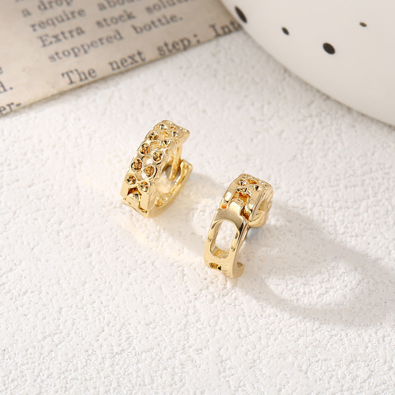 Women's hoop earrings with modern, textured design Symbol Fashion