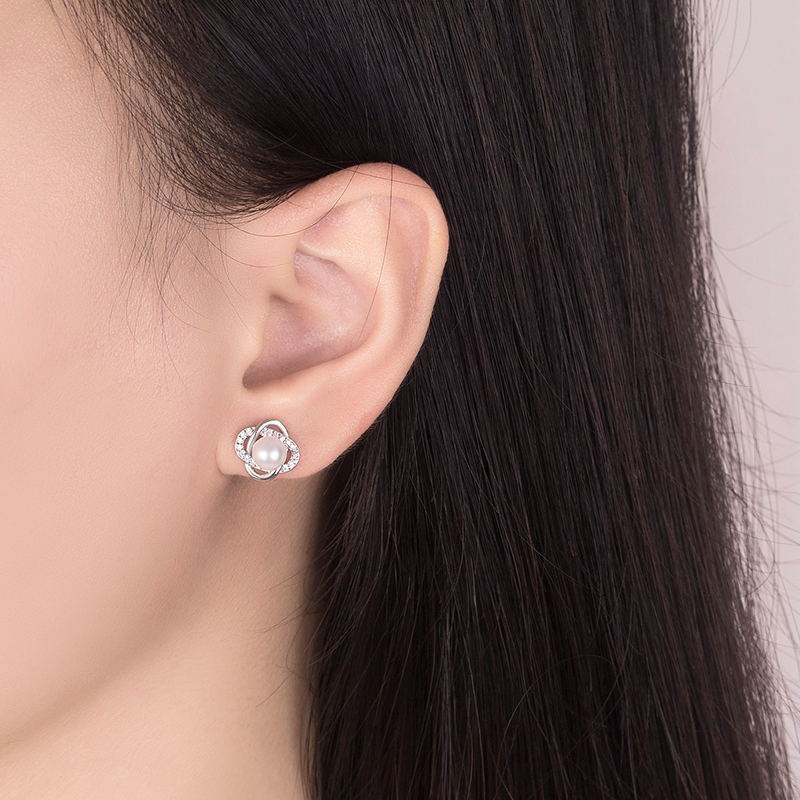 Ladies earrings with artistic pearl design and sparkling zirconia Symbol Fashion