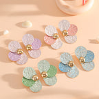 Women's ear clips in elaborate floral pattern Symbol Fashion