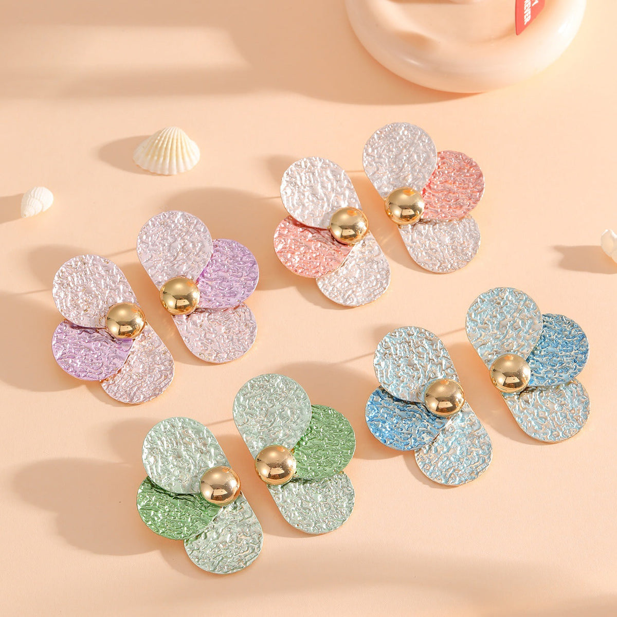 Women's ear clips in elaborate floral pattern Symbol Fashion