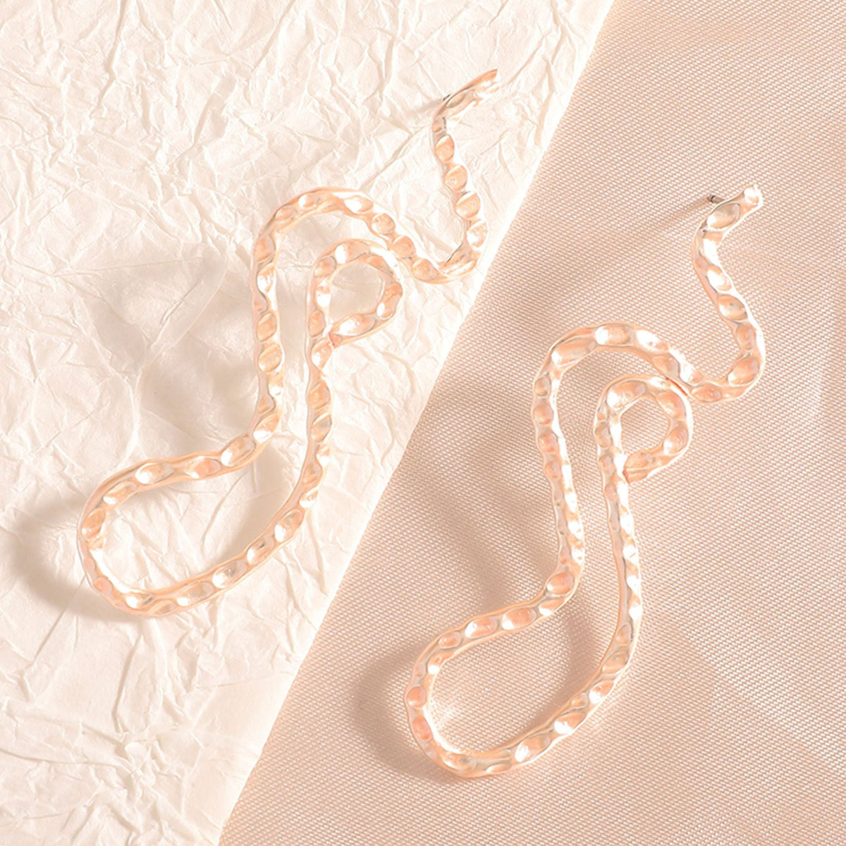 Ladies earrings in elegant wave pattern Symbol Fashion