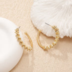 Ladies hoop earrings with intricate structures Symbol Fashion