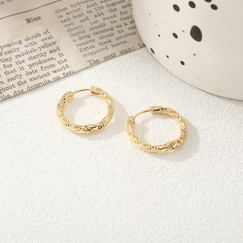Women's hoop earrings with modern, textured design Symbol Fashion