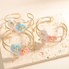 Women's bangle with elaborate floral design Symbol Fashion