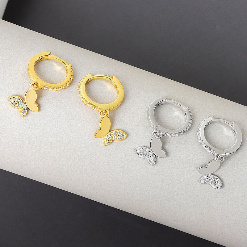 Ladies earrings with elegant butterfly design and sparkling details Symbol Fashion