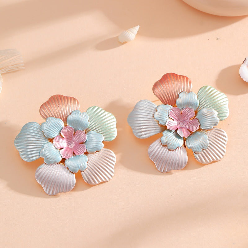 Ladies' flower earrings with intricate design and glossy accents Symbol Fashion