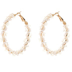 Ladies hoop earrings with luxurious pearl accents and elegant, twisted design Symbol Fashion