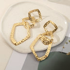 Women's elegant earrings with rustic, folded design Symbol Fashion