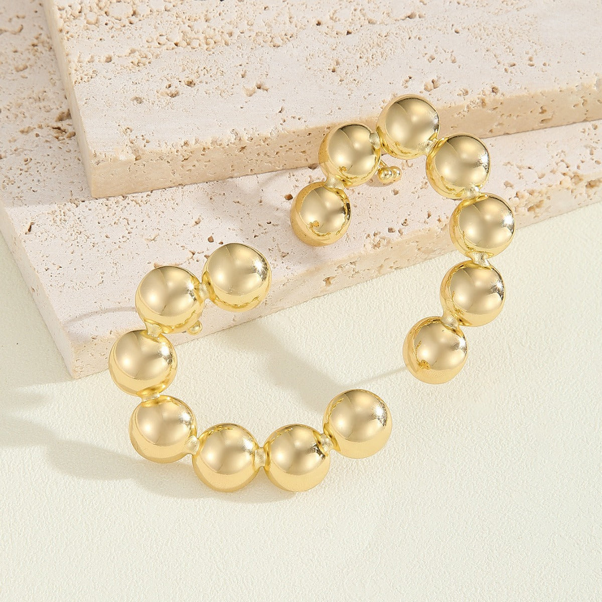 Women's bracelet with structured, golden beads Symbol Fashion