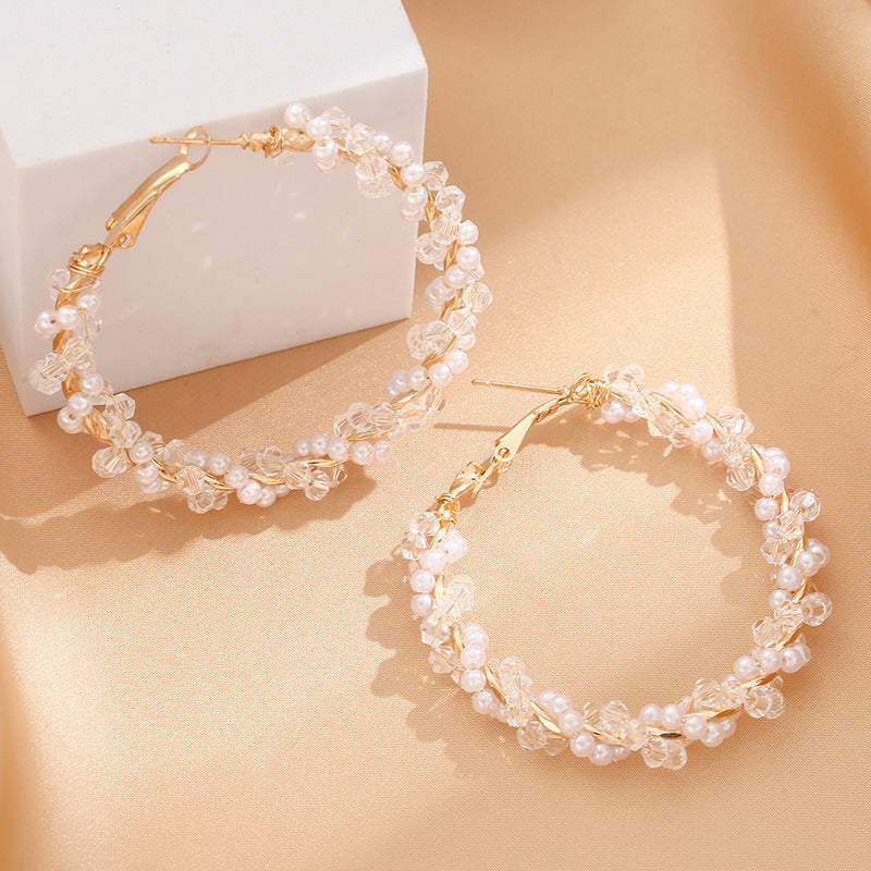 Ladies hoop earrings with luxurious pearl accents and elegant, twisted design Symbol Fashion