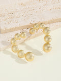 Women's bracelet with structured, golden beads Symbol Fashion