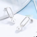 Women's stud earrings with modern oval design and elegant pearls Symbol Fashion