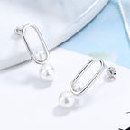 Women's stud earrings with modern oval design and elegant pearls Symbol Fashion