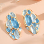 Ladies ear clips with elaborate, colorful shell design Symbol Fashion