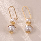 Ladies earrings with elegant pearl design Symbol Fashion