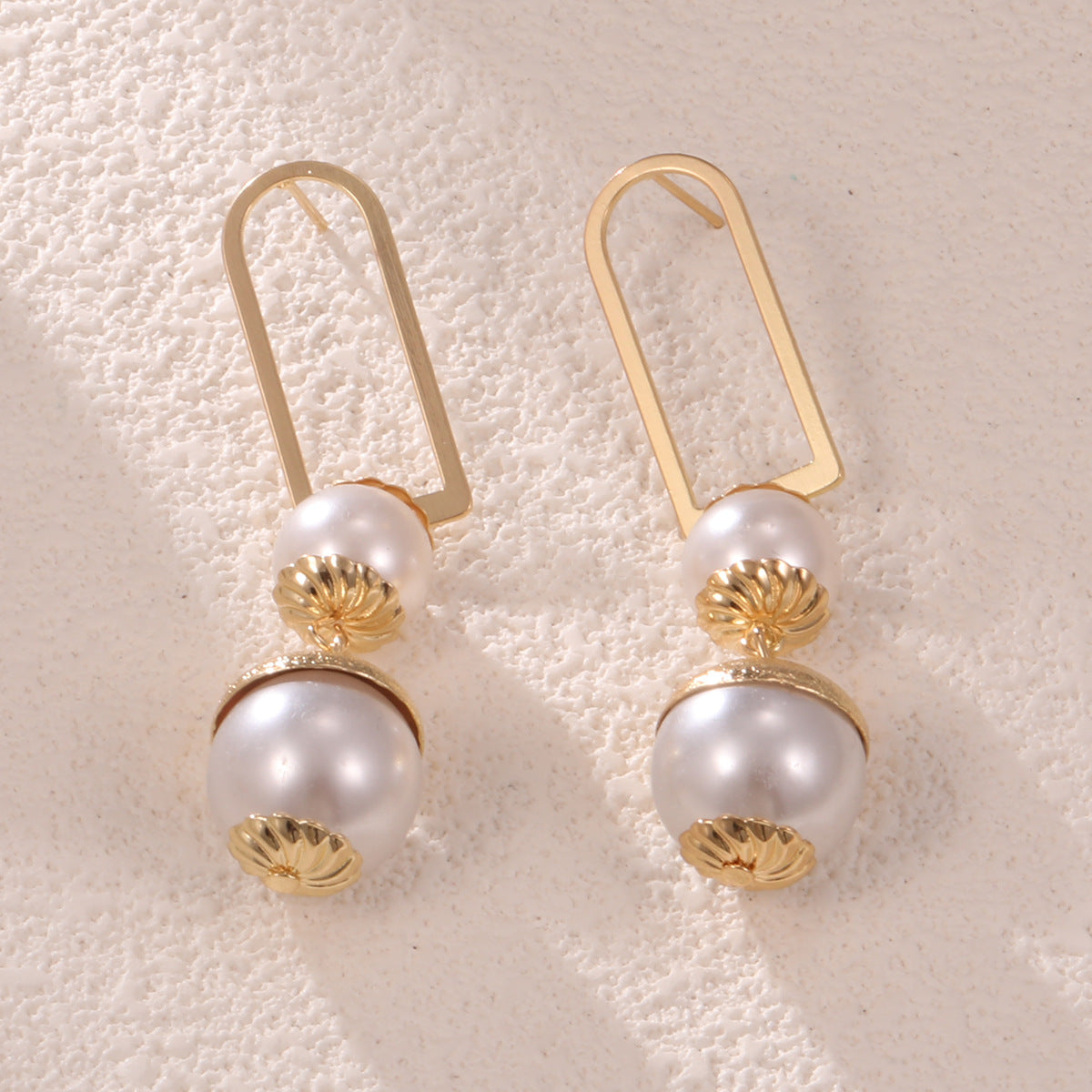 Ladies earrings with elegant pearl design Symbol Fashion