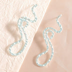 Ladies earrings in elegant wave pattern Symbol Fashion