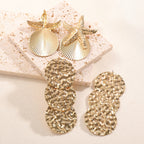 Women's ear clips in luxurious shell and starfish design Symbol Fashion