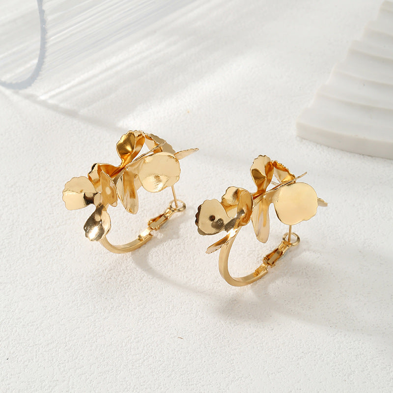 Ladies Creoles with artistic floral ornament Symbol Fashion