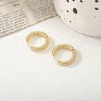 Women's hoop earrings with modern, textured design Symbol Fashion