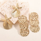 Women's ear clips in luxurious shell and starfish design Symbol Fashion