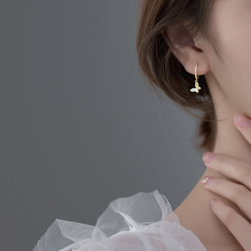 Ladies earrings with elegant butterfly design and sparkling details Symbol Fashion