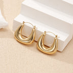 Ladies earrings in a modern, curved design Symbol Fashion